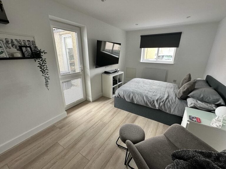 Garage converted into a double bedroom with French door